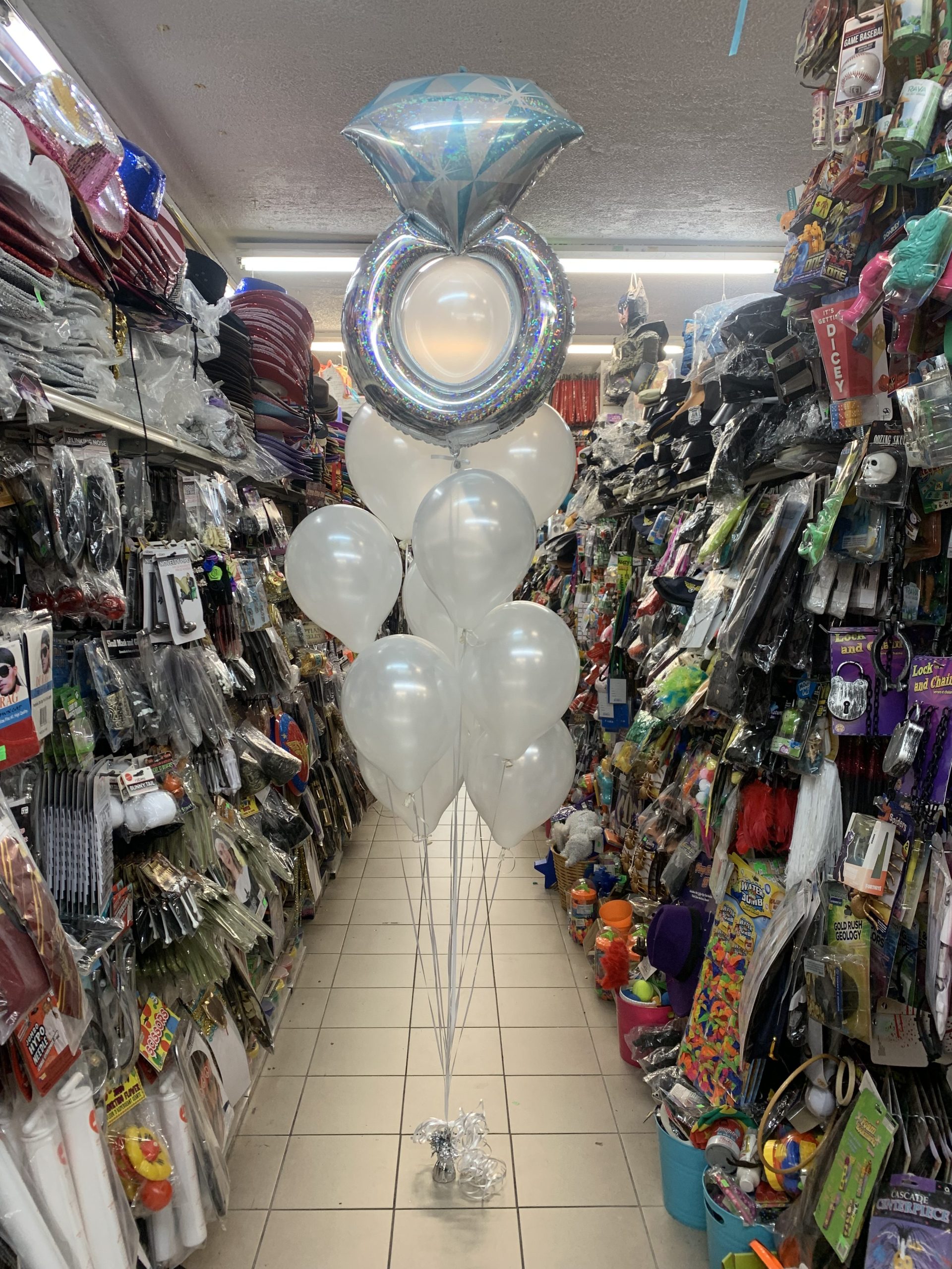 Engagement Ring and Latex Balloons Bouquet With Weight